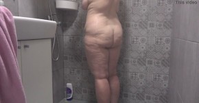 A hidden camera in the shower room spies on a mature wife with a plump figure and big tits and a fat booty Homemade fetish, athe